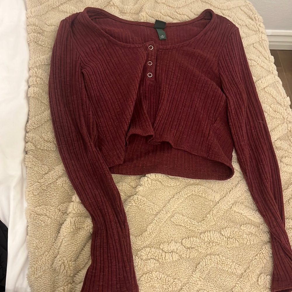 Burgundy long sleeve with buttons that do unbutton